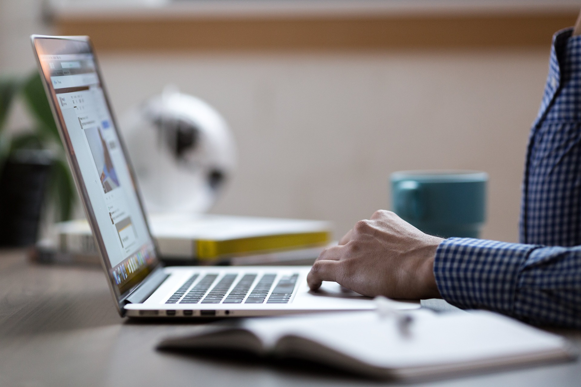 Person typing on laptop